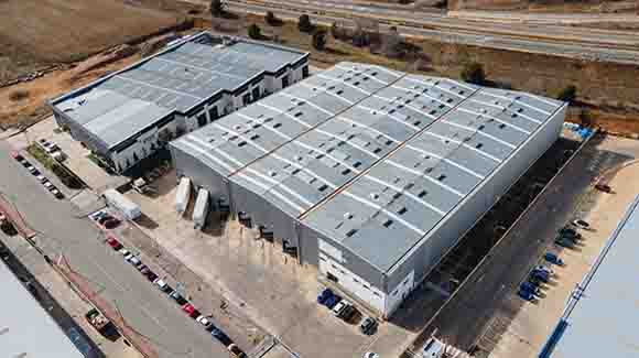 Silver rooftop of a large logistics warehouse