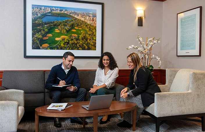 Two female and one male Clarion Partners employees