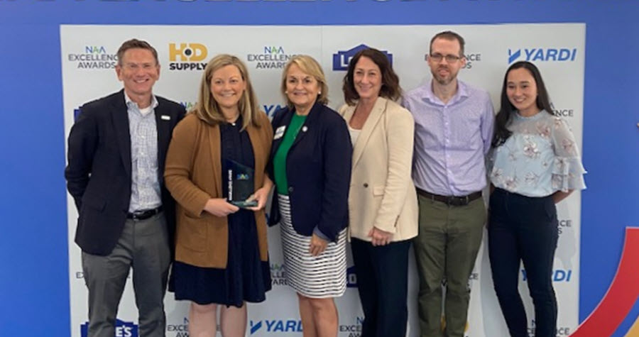 Gables Residential representatives hold the Leading Organization in DEI award trophy