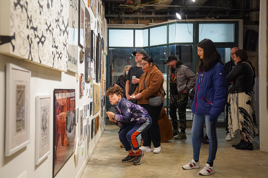 Interior of art gallery with guests