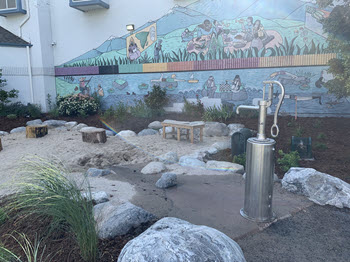 Sandbox area with water fountain