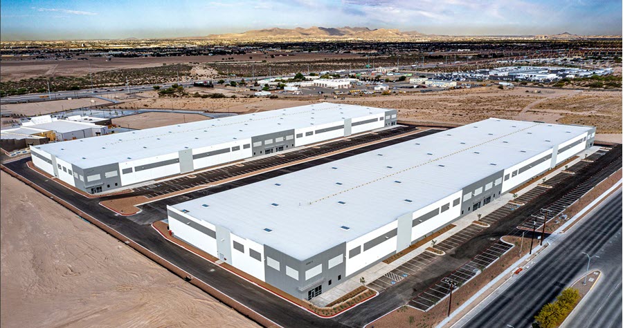 Rendering of two large grey industrial warehouses 