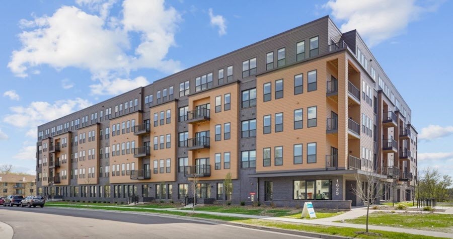 Exterior of grey and light brown multistory residential building