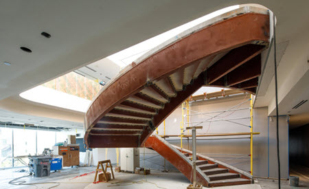 Large, curved stairway under construction