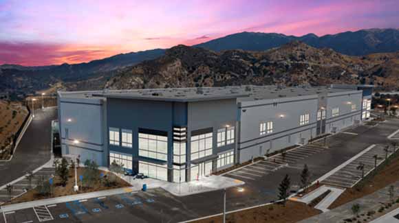 Distribution center with purple night sky in distance